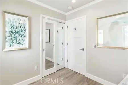 a view of an entryway with wooden floor