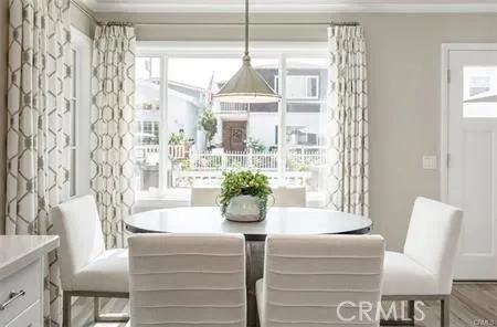 a dining room with furniture and window
