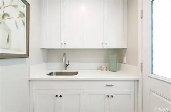 a kitchen with a sink and cabinets