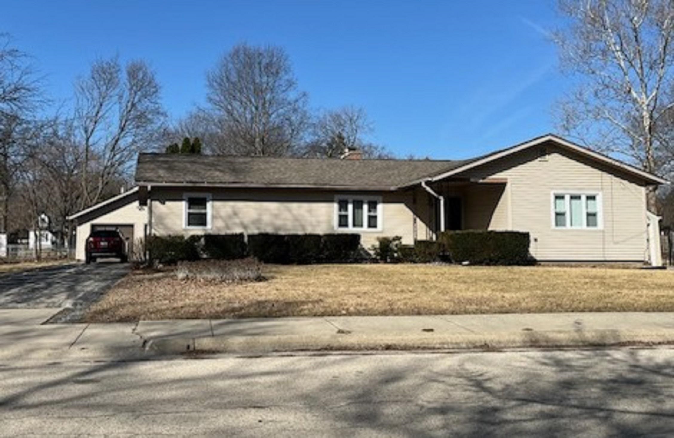 1309 Phelps Avenue Rockford, IL 61108 - Photo 1 of 33 a front view of a house with a yard