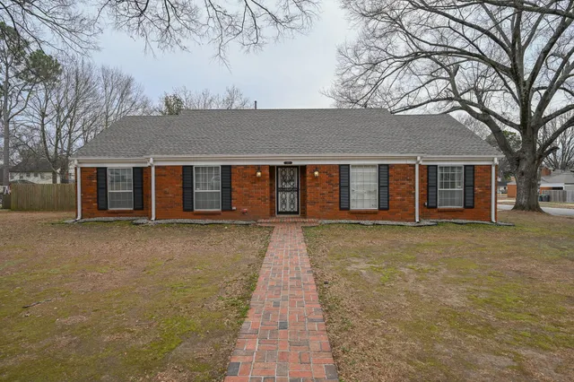 front view of a house with a yard