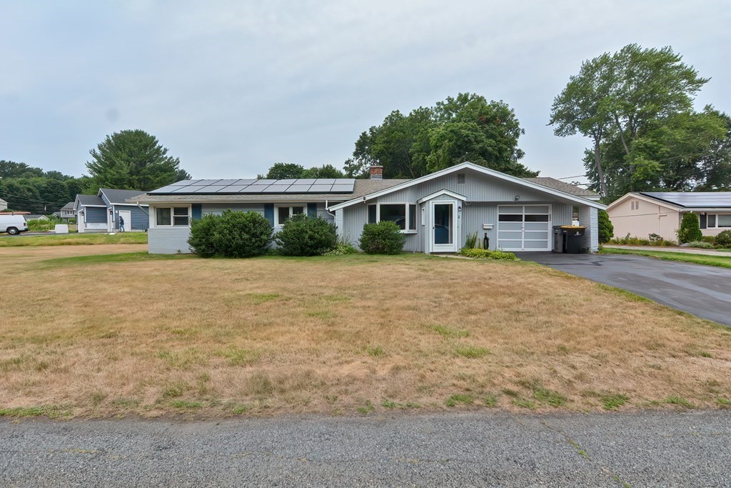 2 Temi Road Framingham, MA 01701 - Photo 1 of 34 a front view of a house with a garden and lake view