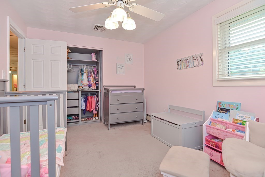 2 Temi Road Framingham, MA 01701 - Photo 21 of 34 a bathroom with a bed mirror and a window