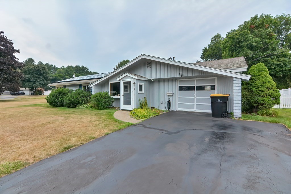 2 Temi Road Framingham, MA 01701 - Photo 27 of 34 a front view of a house with a yard and garage