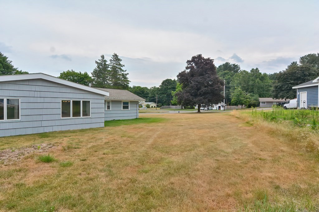 2 Temi Road Framingham, MA 01701 - Photo 29 of 34 a backyard of a house with lots of green space