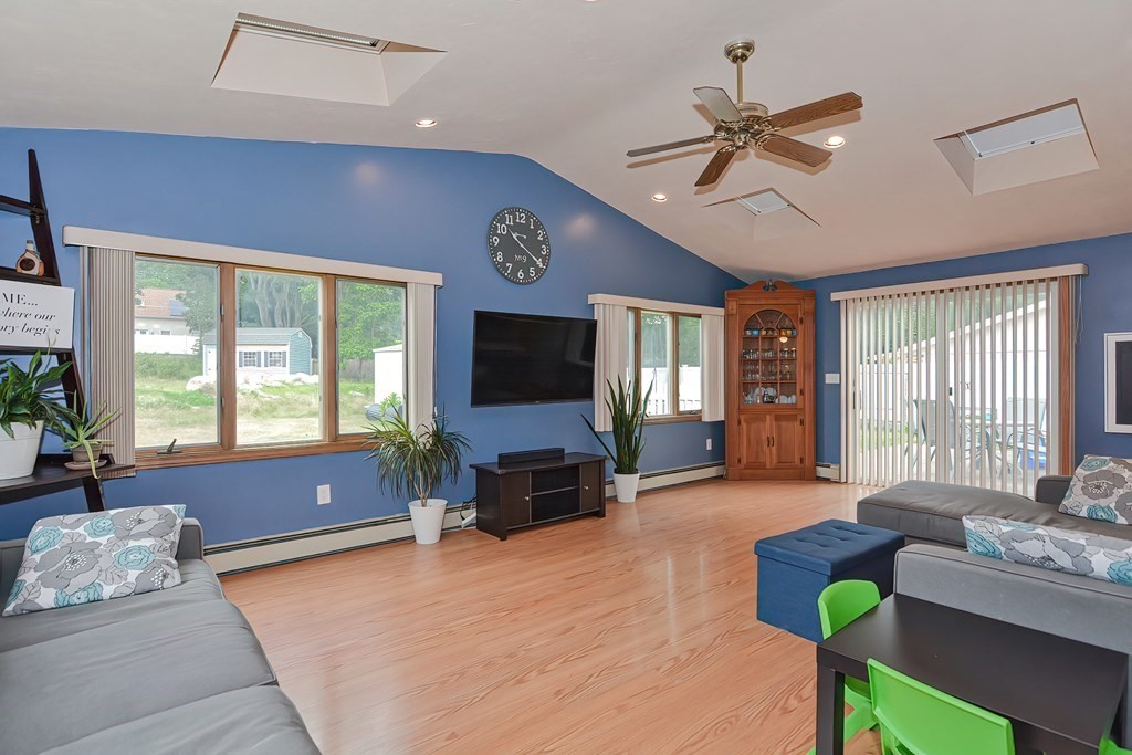 2 Temi Road Framingham, MA 01701 - Photo 3 of 34 a living room with furniture and a flat screen tv