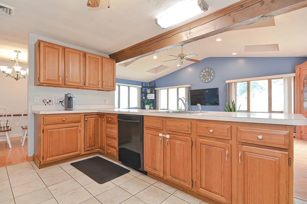 2 Temi Road Framingham, MA 01701 - Photo 6 of 34 a kitchen with granite countertop a sink window and cabinets