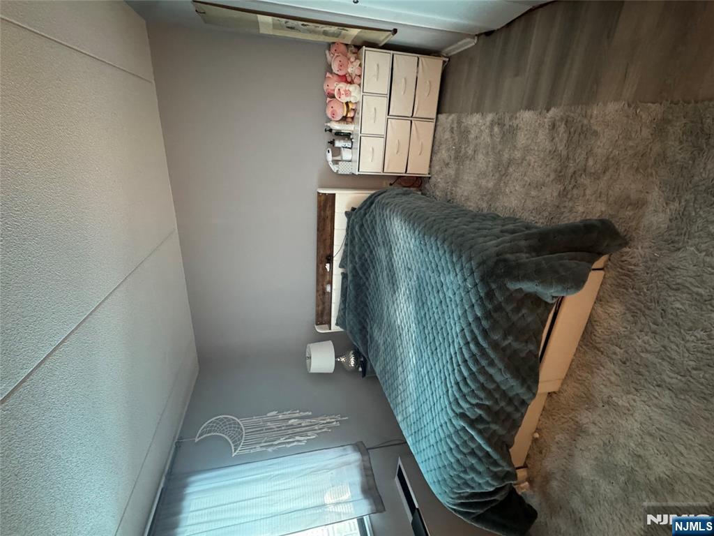 250 Gorge Road, Unit 21E Cliffside Park, NJ 07010 - Photo 4 of 21 a bedroom with a bed and a window