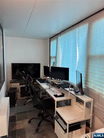 a workspace with furniture and a fireplace