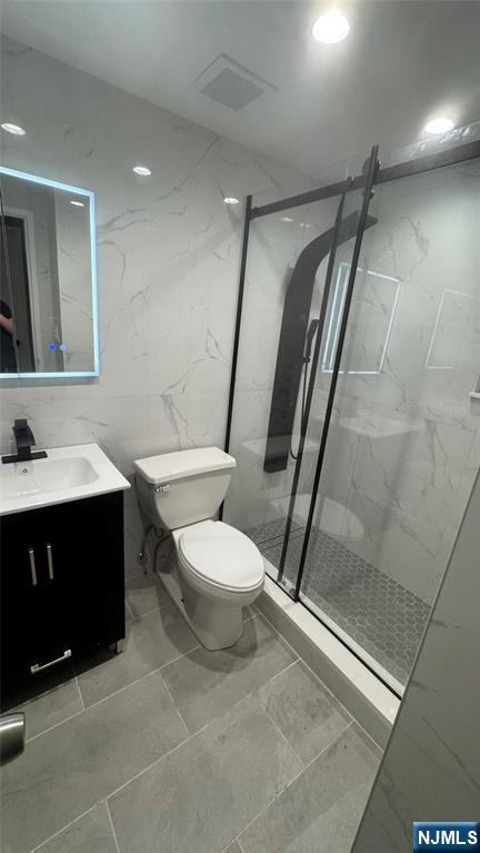 250 Gorge Road, Unit 21E Cliffside Park, NJ 07010 - Photo 7 of 21 a bathroom with a sink a toilet a mirror and shower
