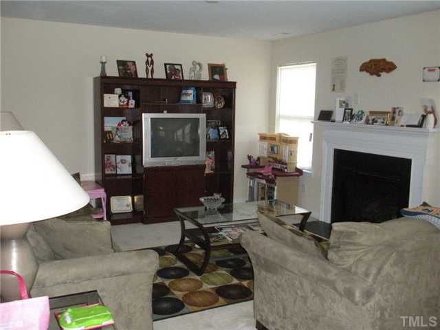 5813 Weddington Road Raleigh, NC 27610 - Photo 3 of 14 Family room with fireplace is open to the kitchen and breakfast area ...