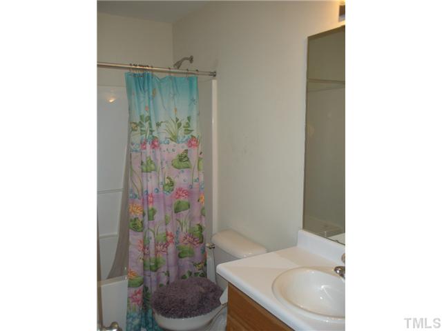 5813 Weddington Road Raleigh, NC 27610 - Photo 10 of 14 Bedroom 2 and 3 share this bathroom.