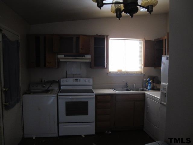901 Hadley Road Raleigh, NC 27610 - Photo 2 of 9 a kitchen with a sink stove and microwave
