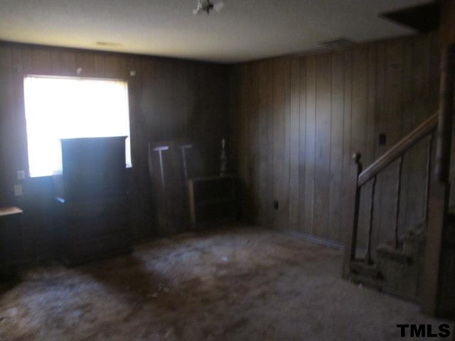 901 Hadley Road Raleigh, NC 27610 - Photo 5 of 9 an empty room with windows