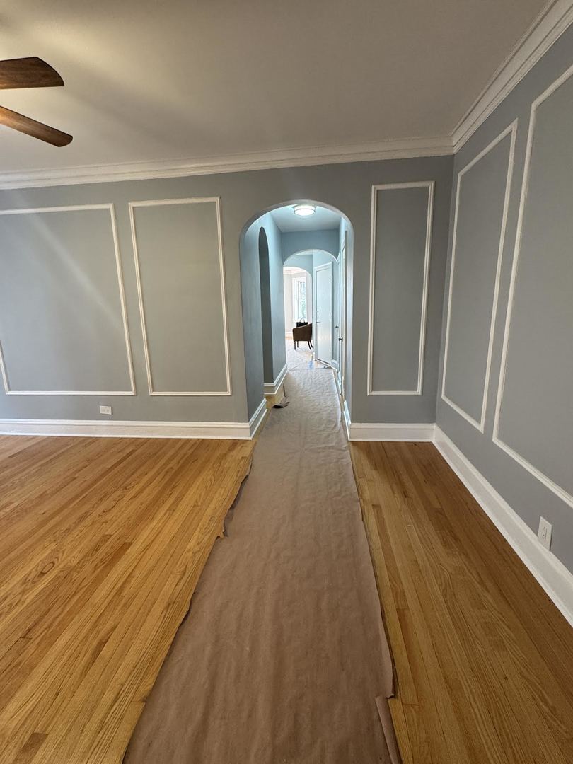 6231 North Francisco Avenue, Unit 2S Chicago, IL 60659 - Photo 7 of 24 a view of a room with wooden floor and chair