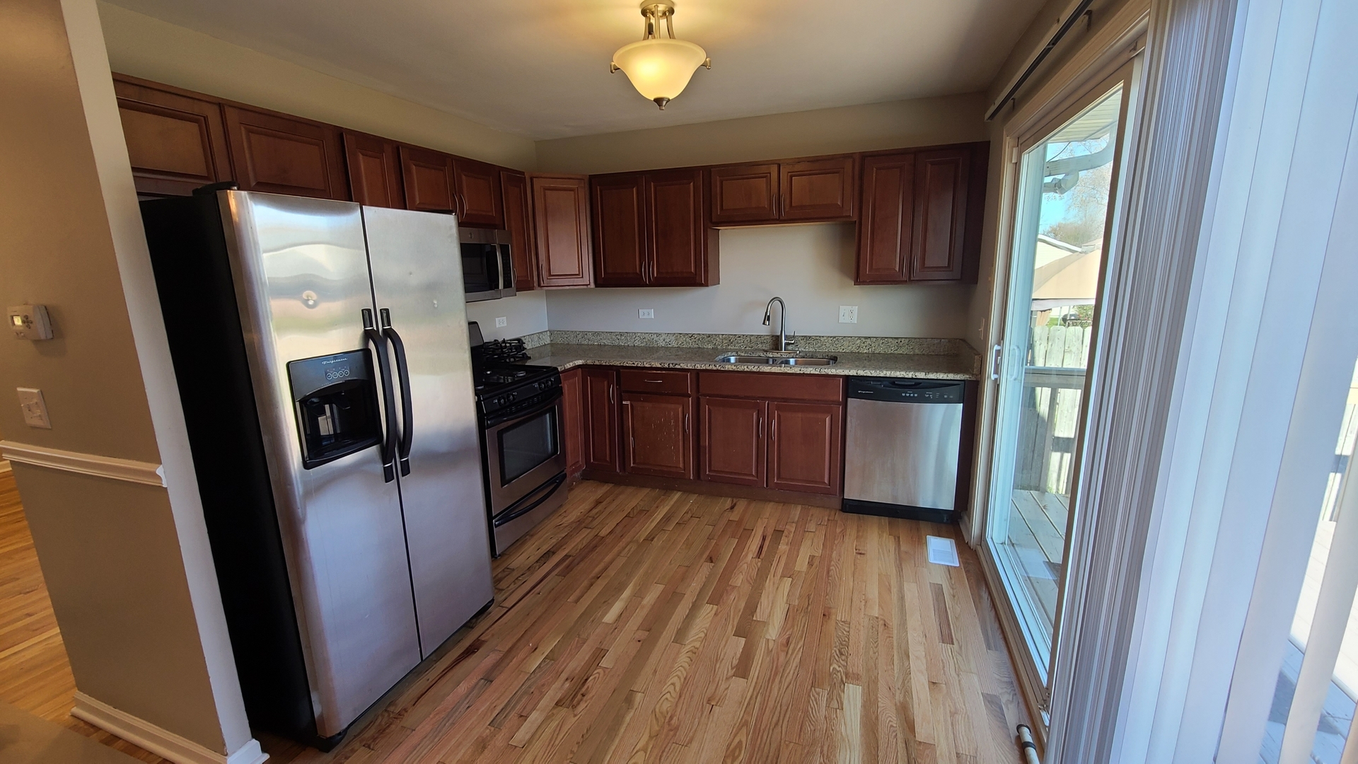 125 Deerpath Road Matteson, IL 60443 - Photo 12 of 19 a kitchen with stainless steel appliances granite countertop refrigerator a sink dishwasher a stove top oven a refrigerator and cabinets