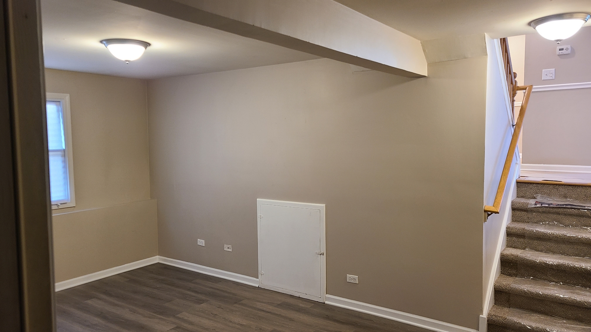125 Deerpath Road Matteson, IL 60443 - Photo 8 of 19 a view of an empty room with wooden floor and a window