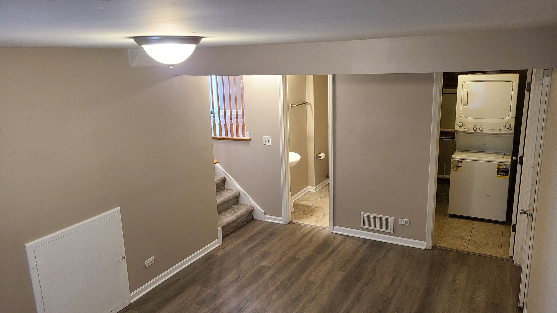 125 Deerpath Road Matteson, IL 60443 - Photo 9 of 19 a view of a room with wooden floor and a bathroom