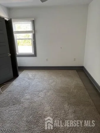 a view of a room that has a window in it