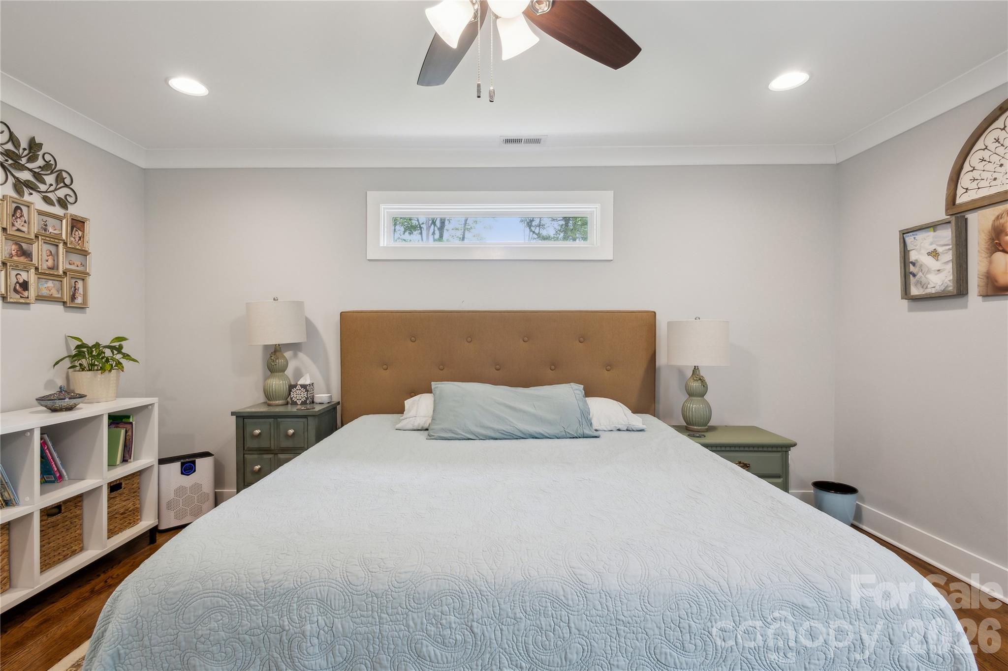 7200 Monroe Road Charlotte, NC 28212 - Photo 15 of 37 a bedroom with a bed and a painting on the wall