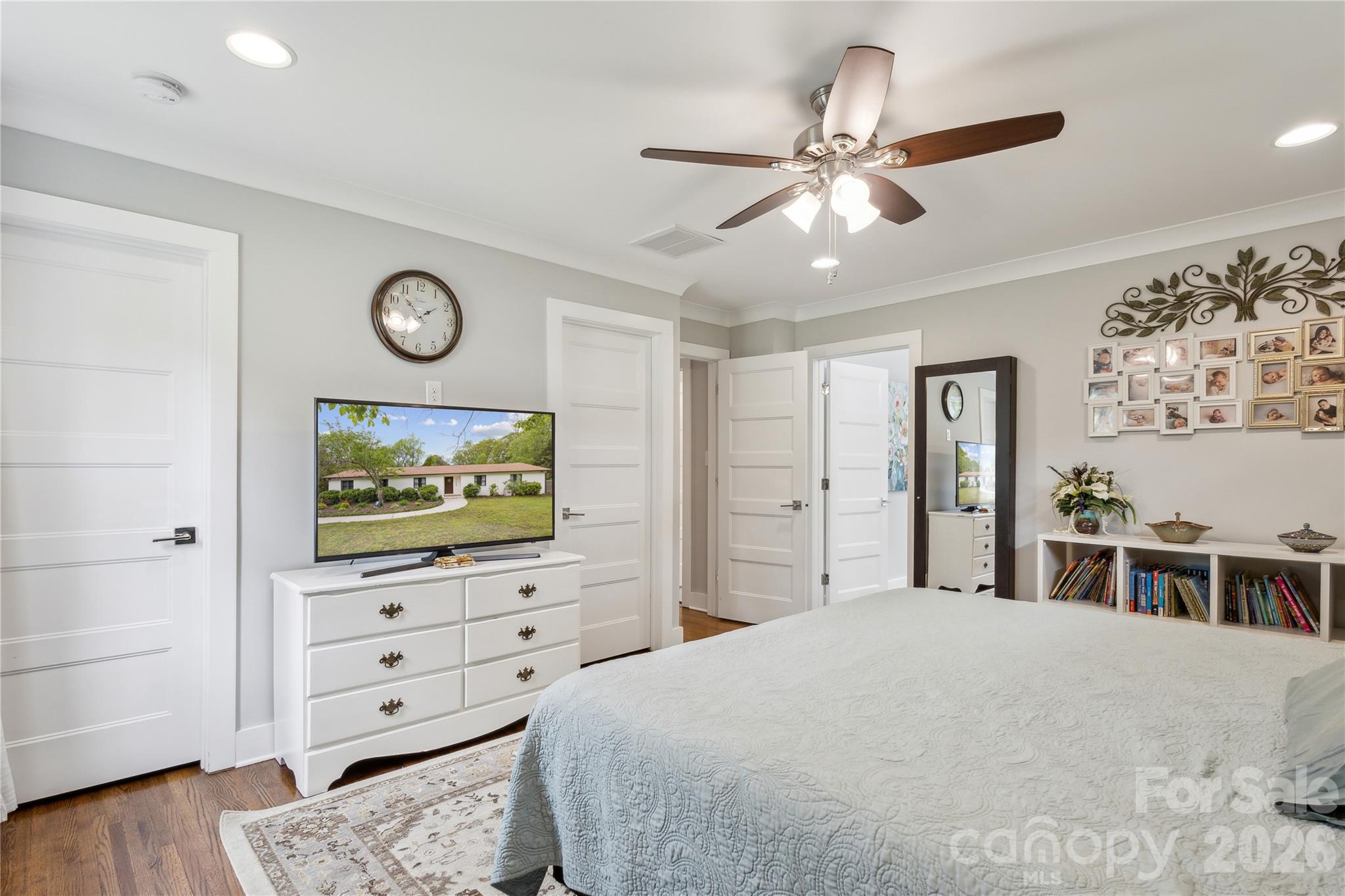 7200 Monroe Road Charlotte, NC 28212 - Photo 16 of 37 a bedroom with a bed and wooden floor