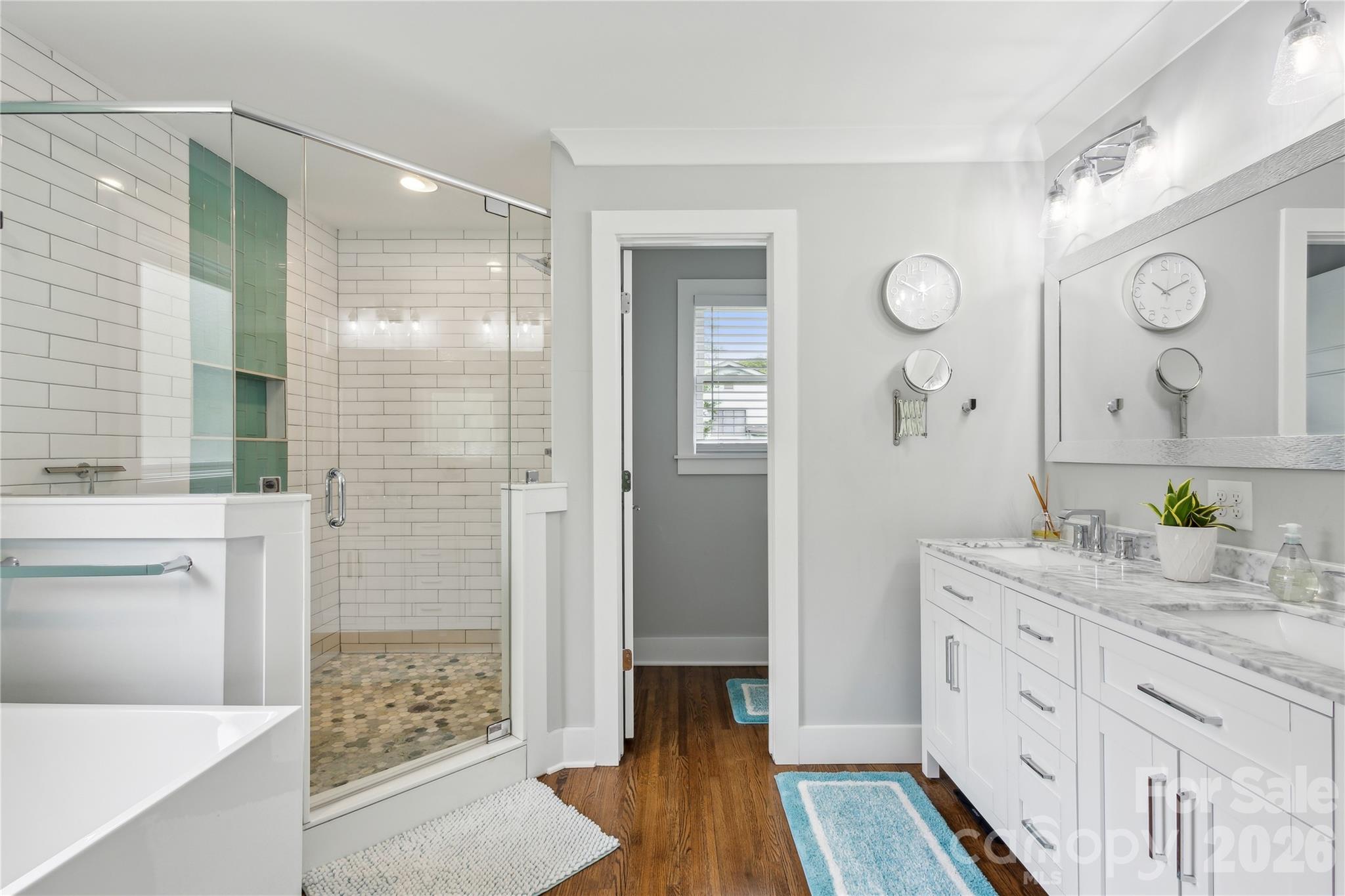 7200 Monroe Road Charlotte, NC 28212 - Photo 17 of 37 a spacious bathroom with double vanity and a shower
