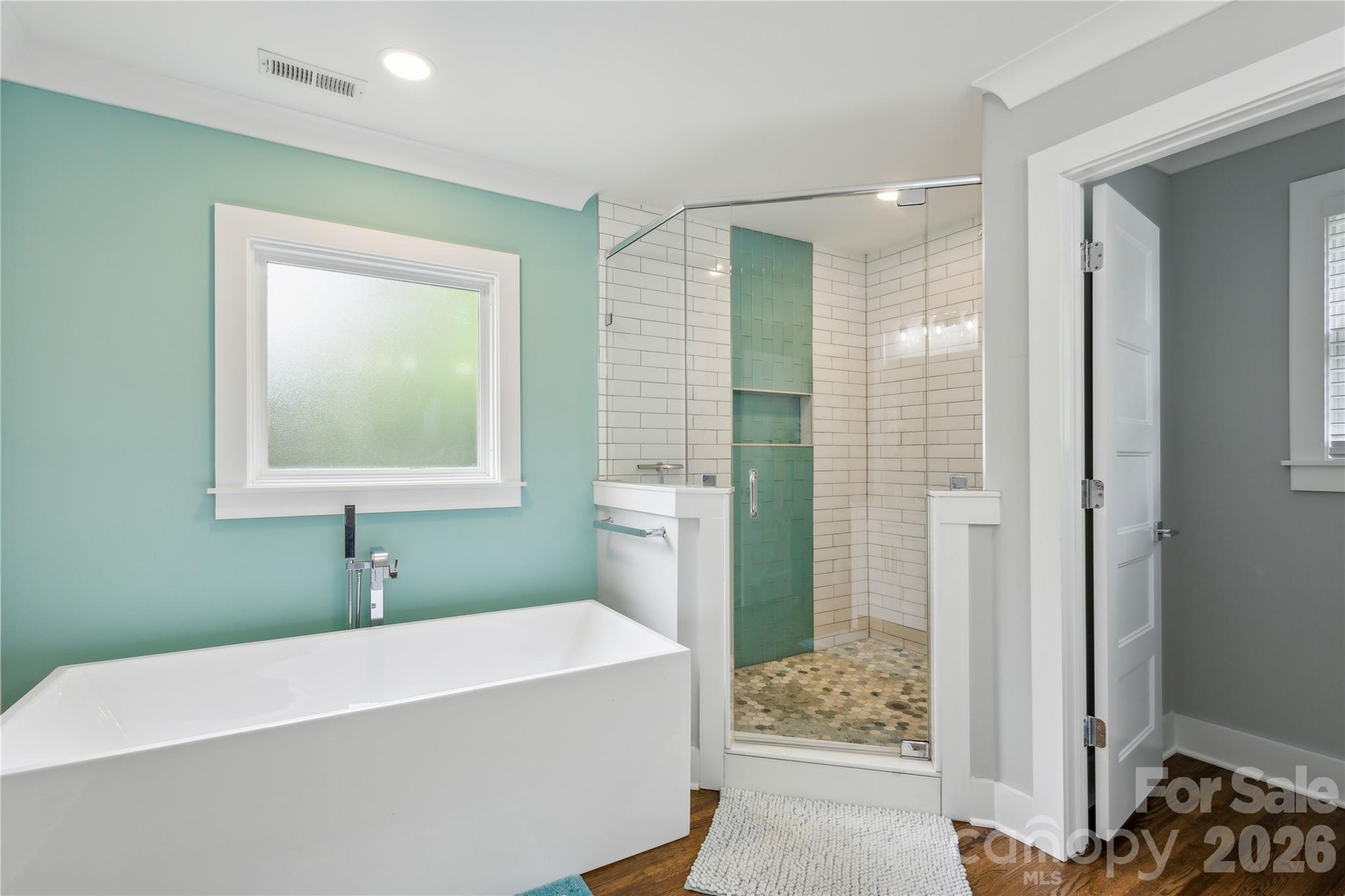 7200 Monroe Road Charlotte, NC 28212 - Photo 18 of 37 a bathroom with a bathtub and shower