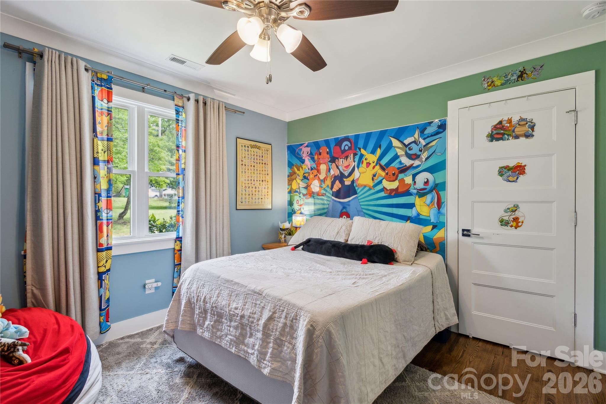 7200 Monroe Road Charlotte, NC 28212 - Photo 21 of 37 a bedroom with a bed and a chandelier