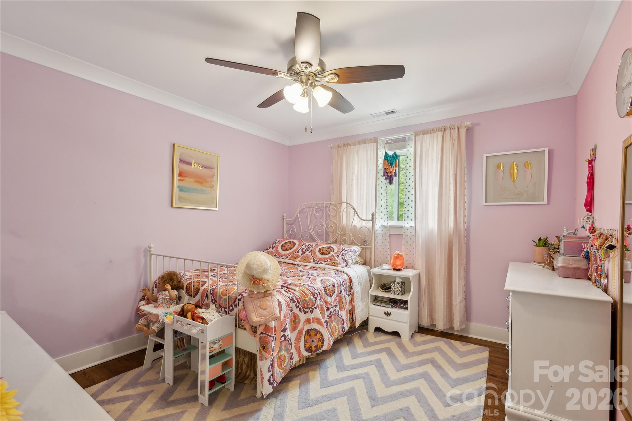 7200 Monroe Road Charlotte, NC 28212 - Photo 23 of 37 a bedroom with a bed and a chandelier