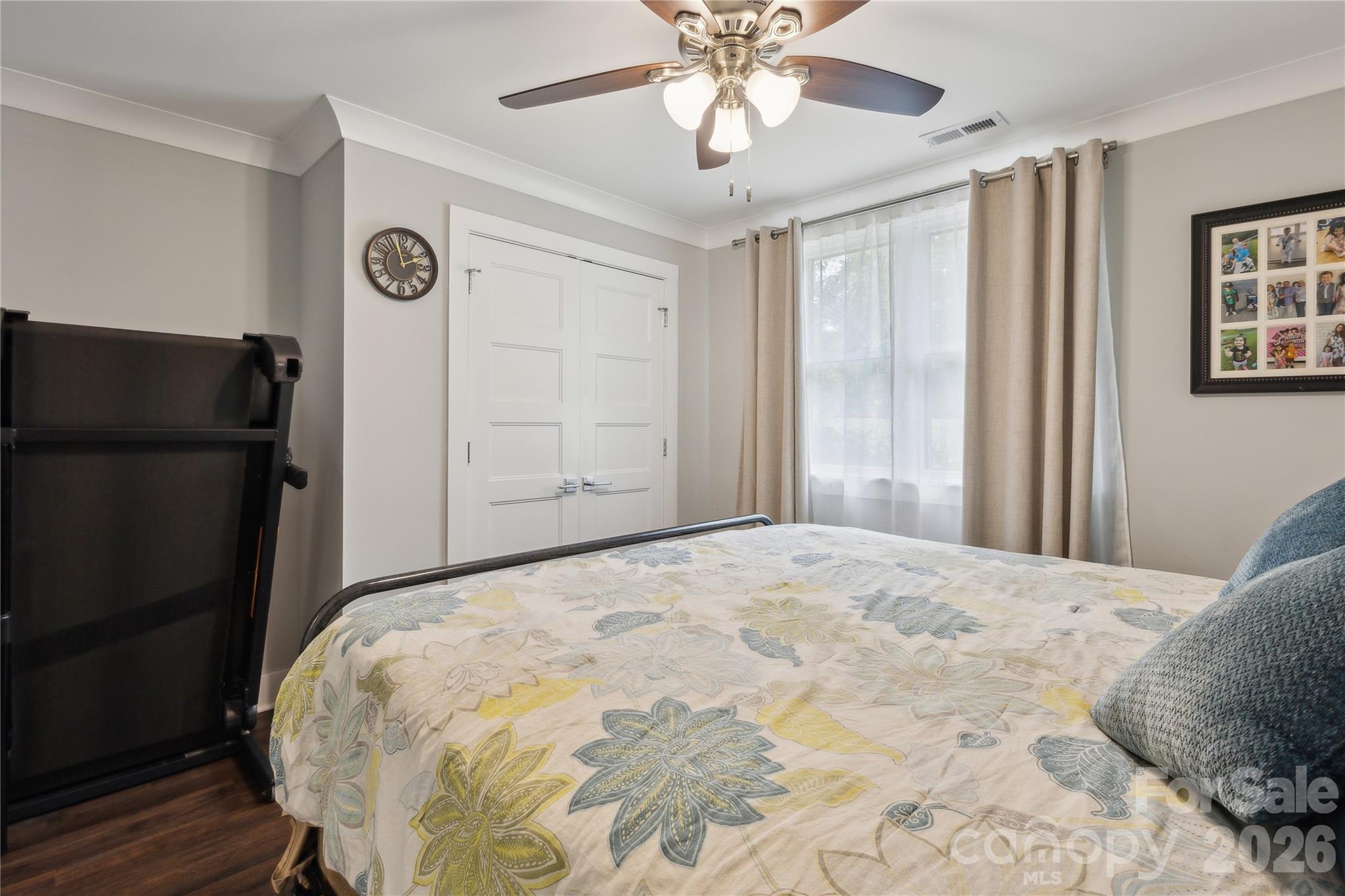 7200 Monroe Road Charlotte, NC 28212 - Photo 26 of 37 a bedroom with a bed and a chandelier