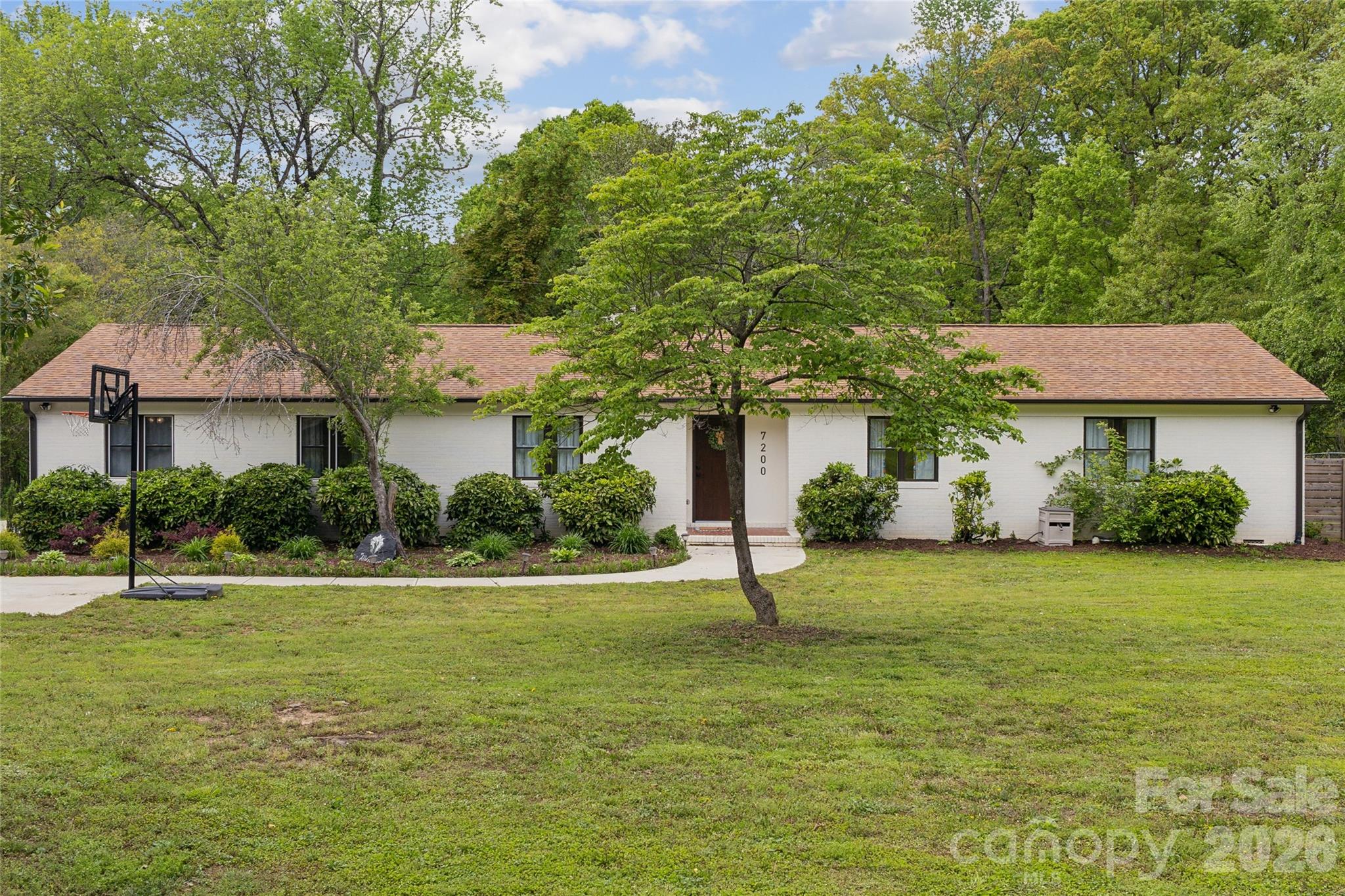 7200 Monroe Road Charlotte, NC 28212 - Photo 3 of 37 a front view of a house with a yard