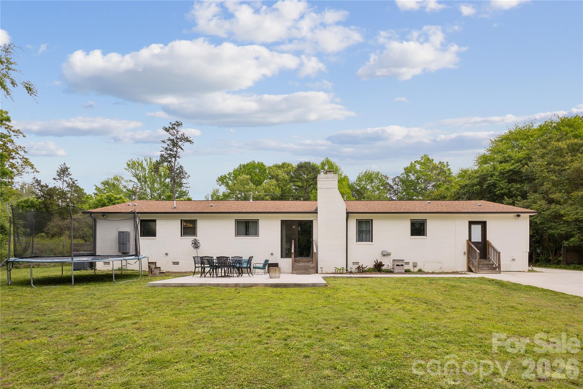 7200 Monroe Road Charlotte, NC 28212 - Photo 31 of 37 a front view of house with yard barbeque and outdoor seating