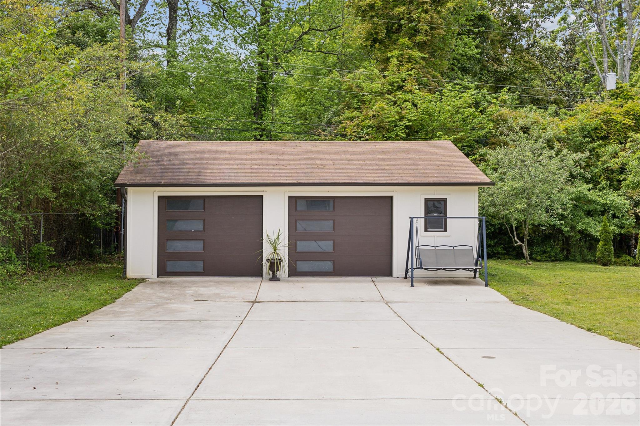 7200 Monroe Road Charlotte, NC 28212 - Photo 34 of 37 a front view of a house with yard and trees