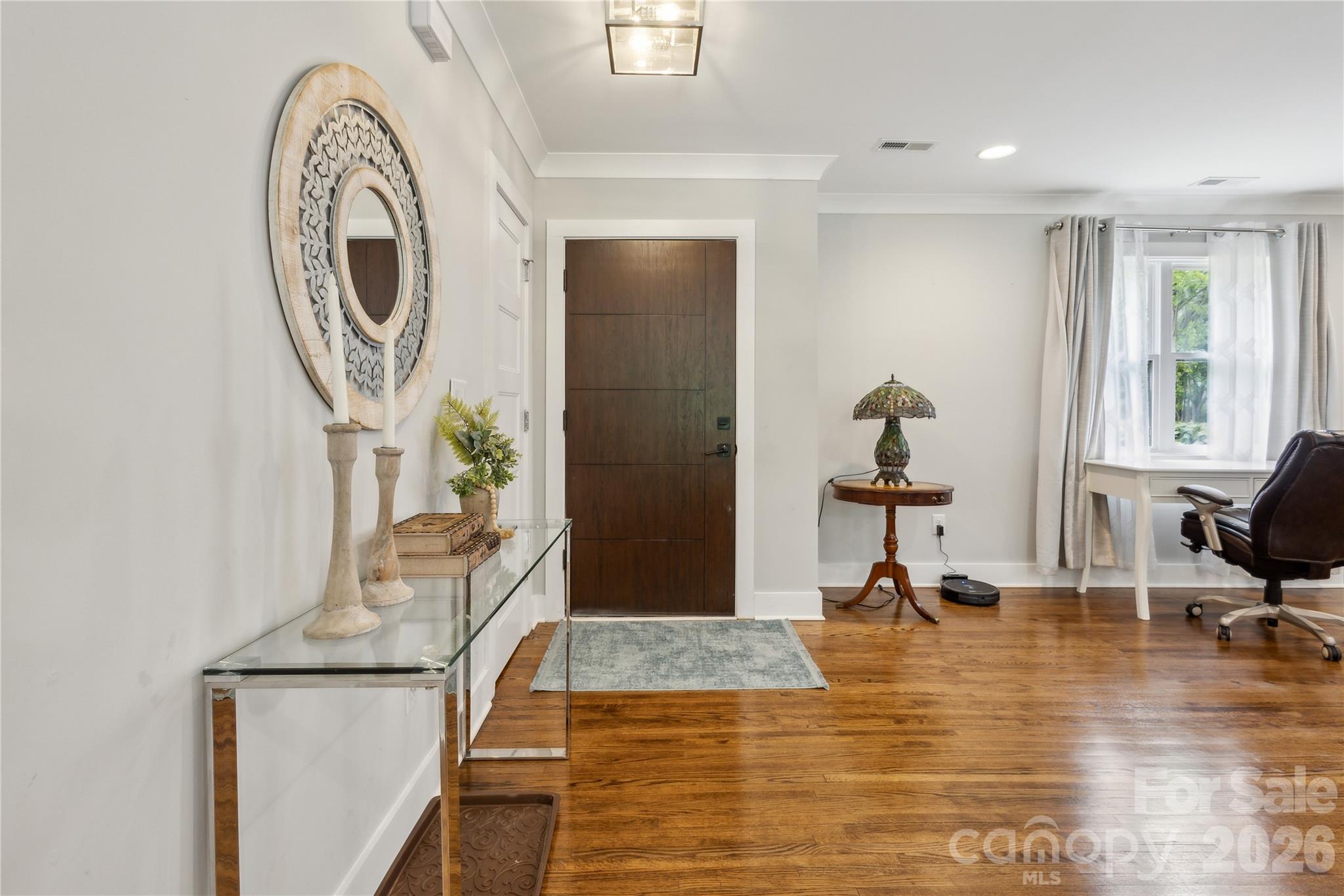 7200 Monroe Road Charlotte, NC 28212 - Photo 4 of 37 a view of living room filled with furniture and a mirror