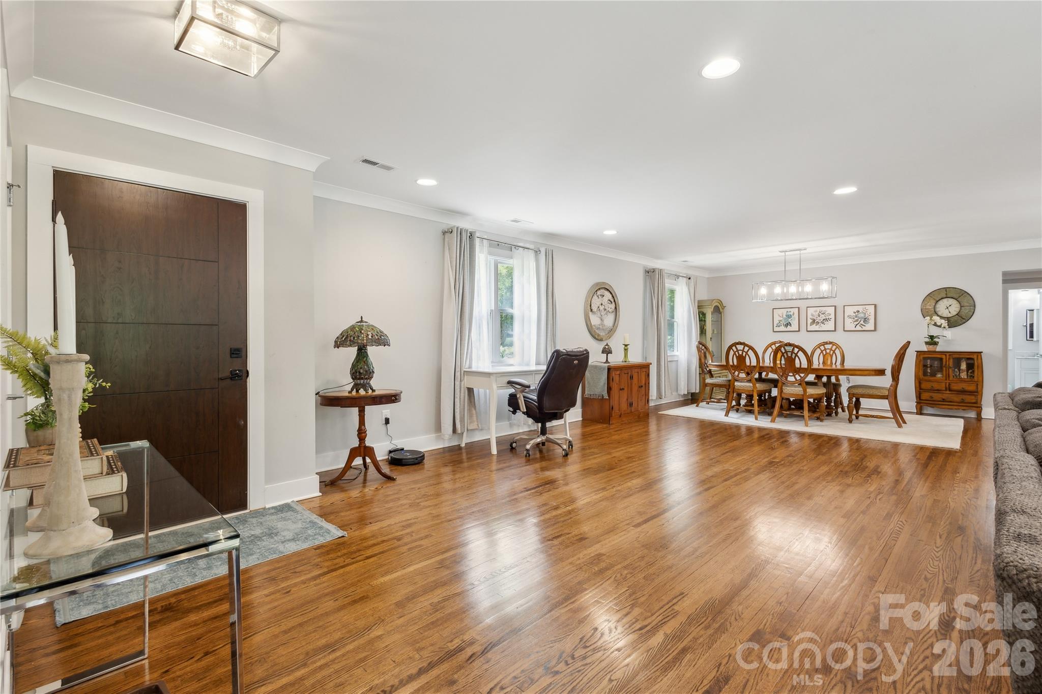 7200 Monroe Road Charlotte, NC 28212 - Photo 5 of 37 a view of a livingroom with furniture and a flat screen tv