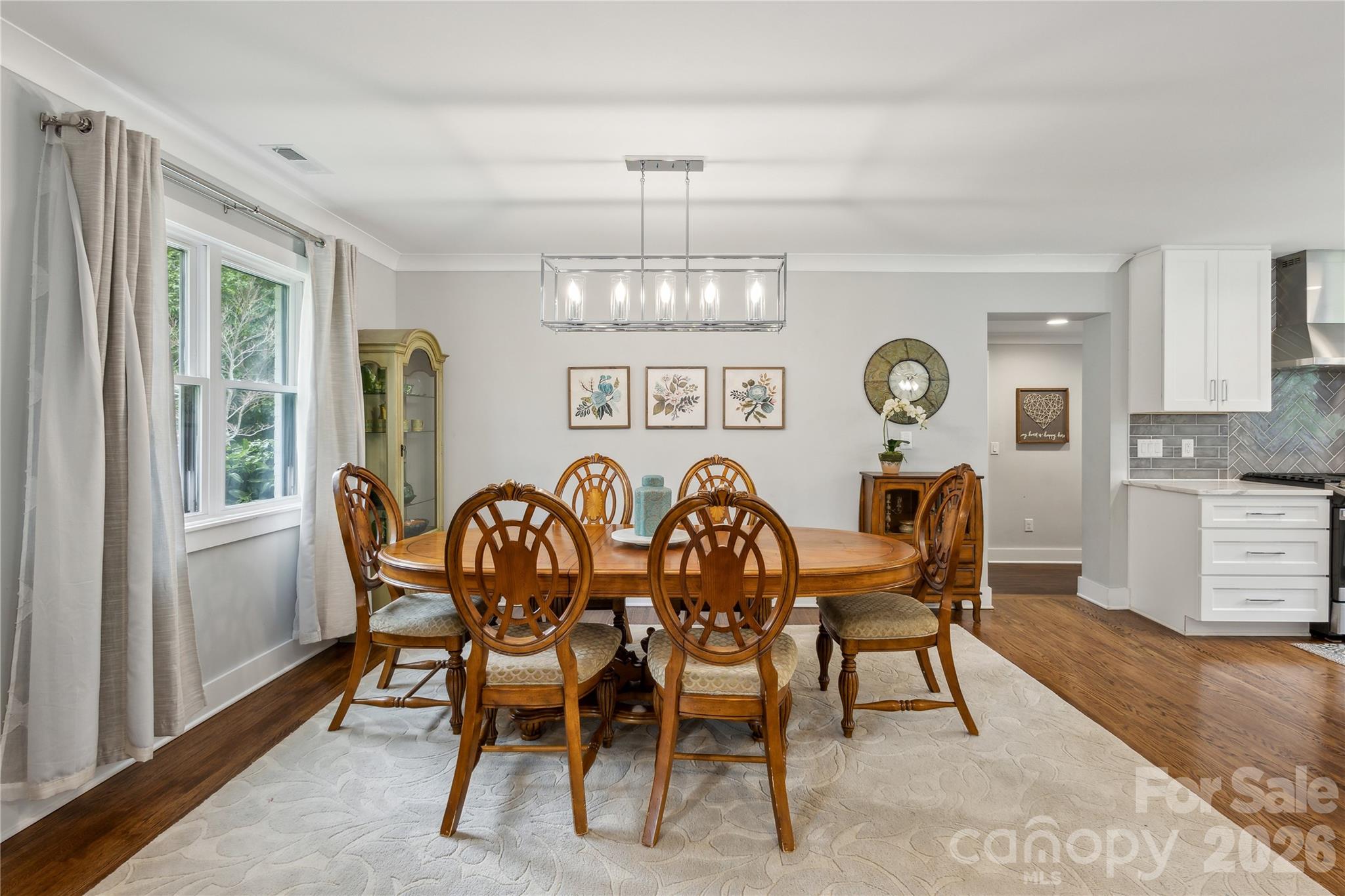 7200 Monroe Road Charlotte, NC 28212 - Photo 6 of 37 a view of a dining room with furniture window and wooden floor
