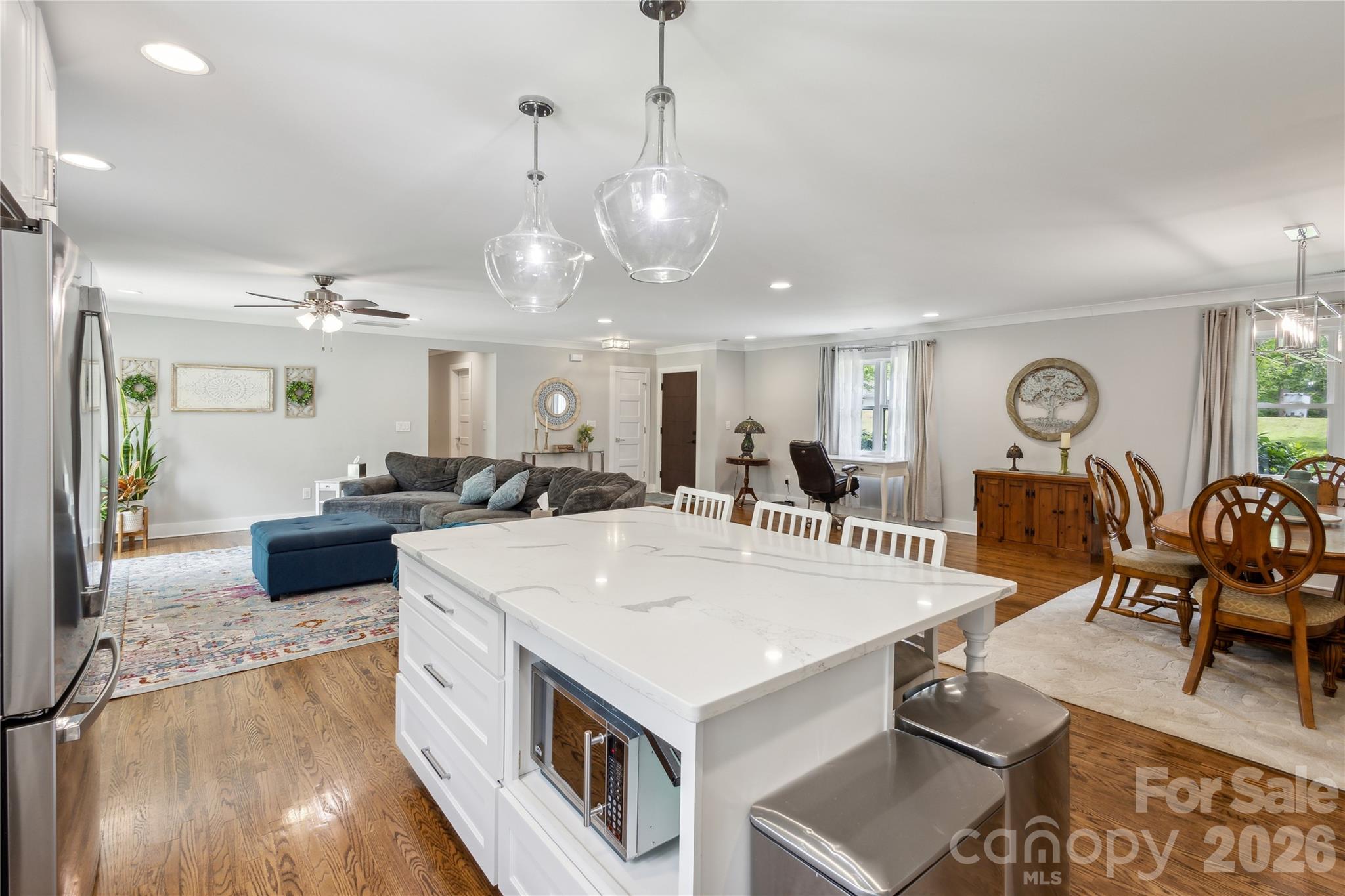7200 Monroe Road Charlotte, NC 28212 - Photo 10 of 37 a large kitchen with a table and chairs