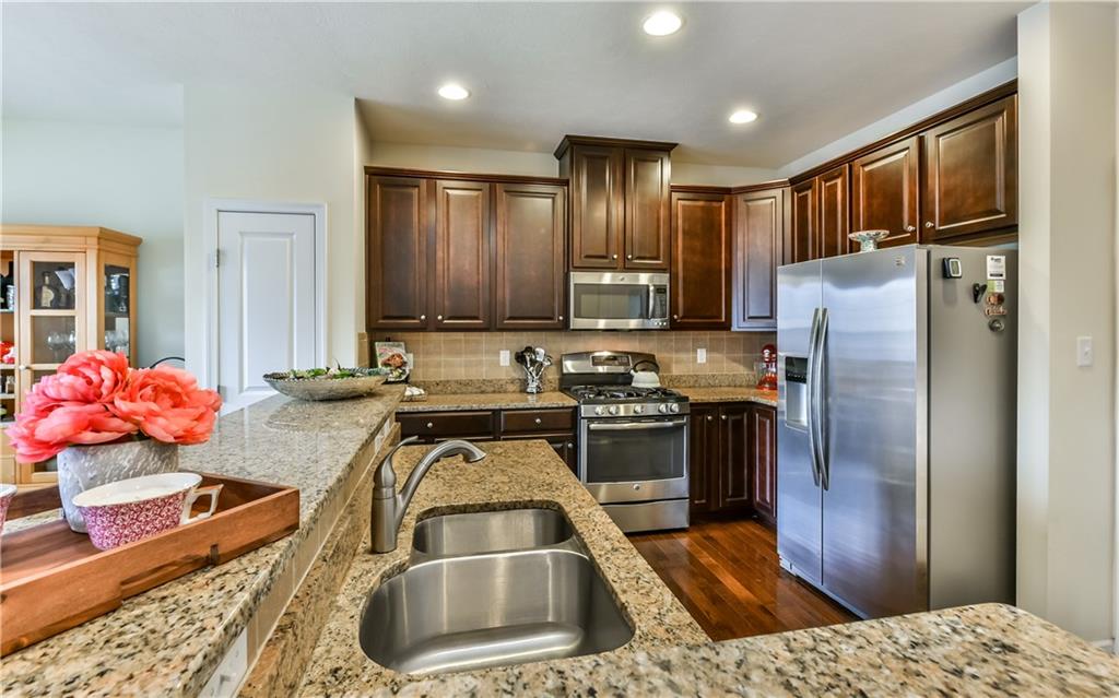 504 Rosecliff Road Wexford, PA 15090 - Photo 8 of 25 KITCHEN ISLAND WITH BAR AND SINK