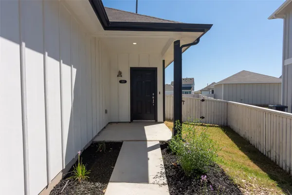 a view of a back yard from a balcony