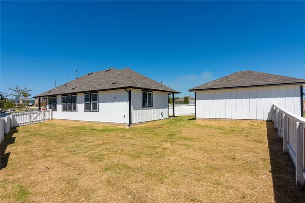a house with trees in the background