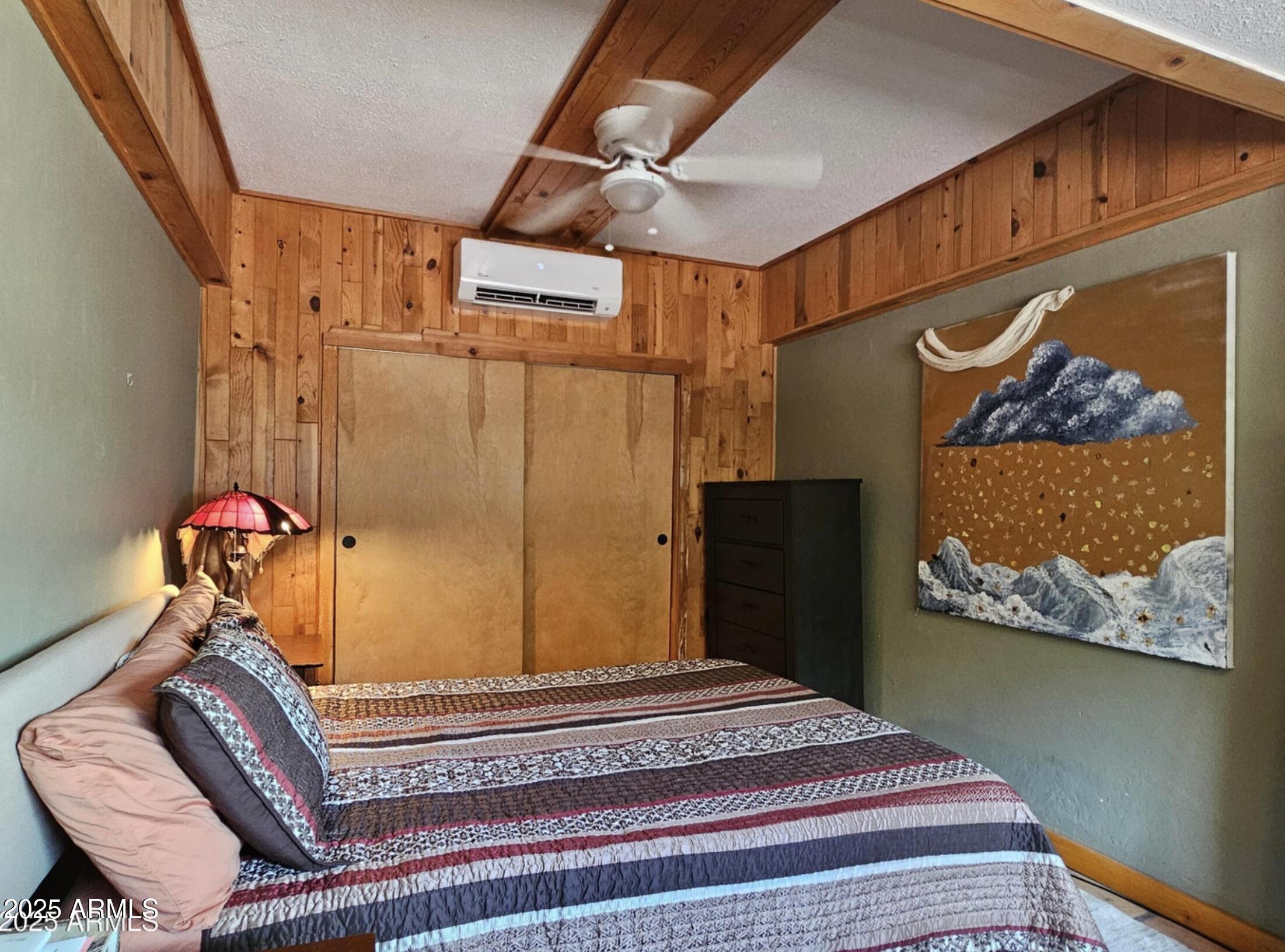 25 Cole Avenue Bisbee, AZ 85603 - Photo 13 of 15 a bedroom with a bed and furniture