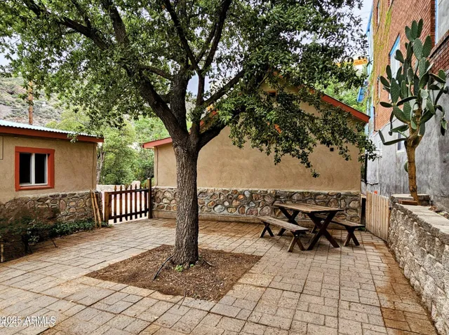 a view of a backyard with sitting area