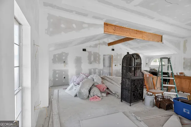 a room with furniture and a window