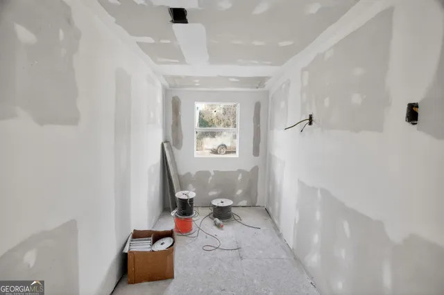 a bathroom with a glass shower door