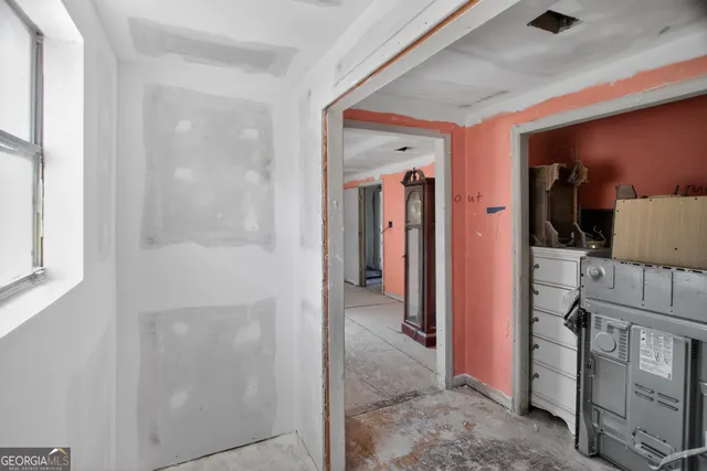 a room with furniture and wooden floor