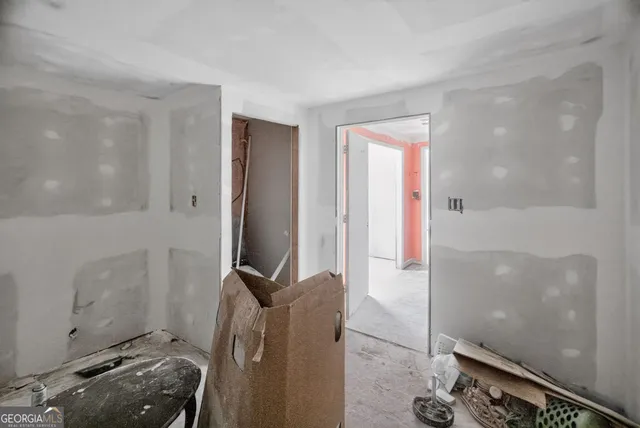 a view of an entryway with wooden floor