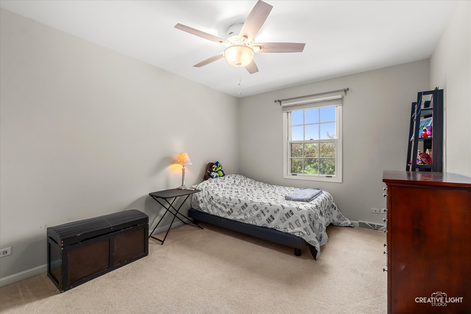 27W343 Churchill Road Winfield, IL 60190 - Photo 14 of 40 a bedroom with a bed and a window