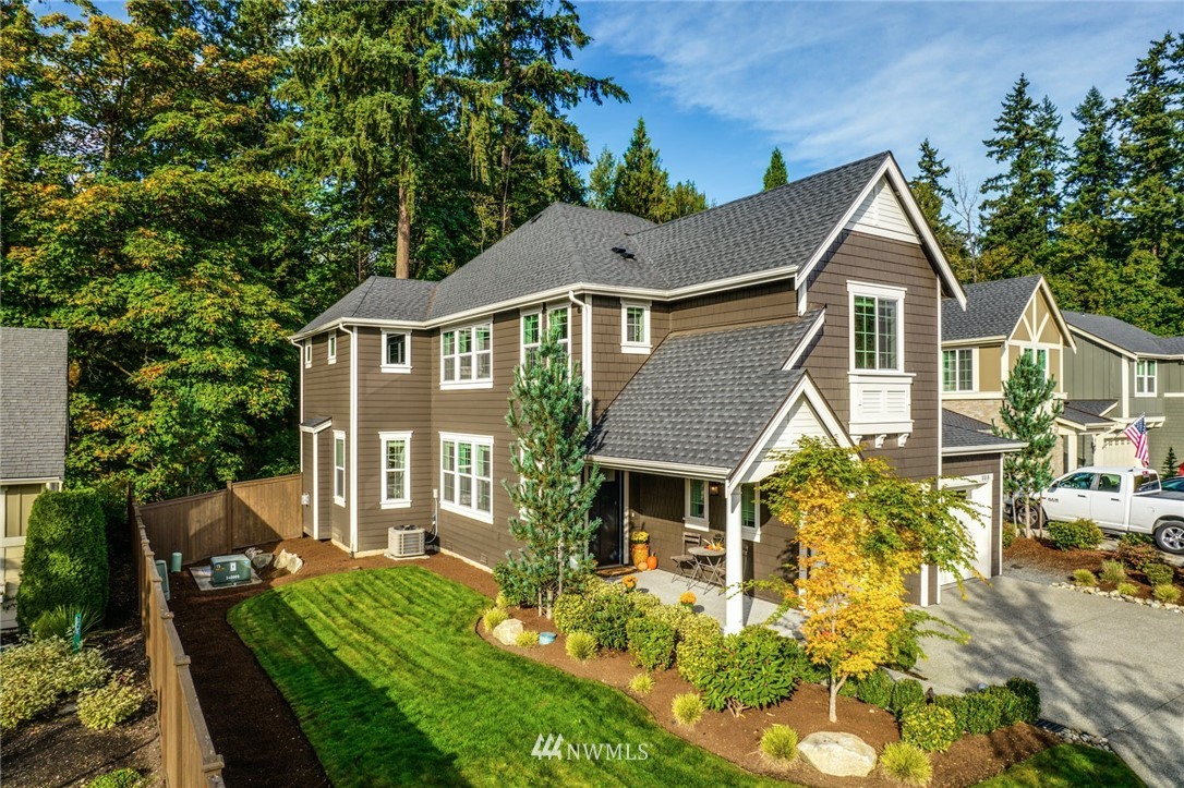 3318 238th Place Southeast Bothell, WA 98021 - Photo 1 of 36 a front view of a house with garden