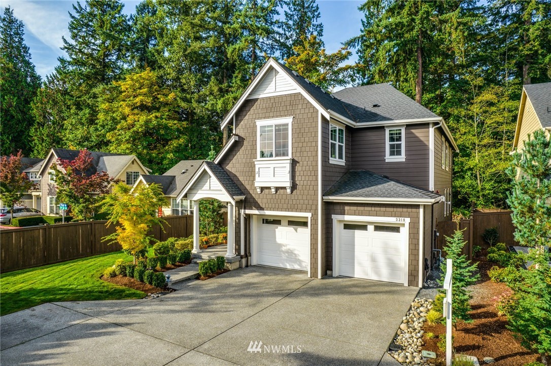 3318 238th Place Southeast Bothell, WA 98021 - Photo 2 of 36 a front view of a house with garden