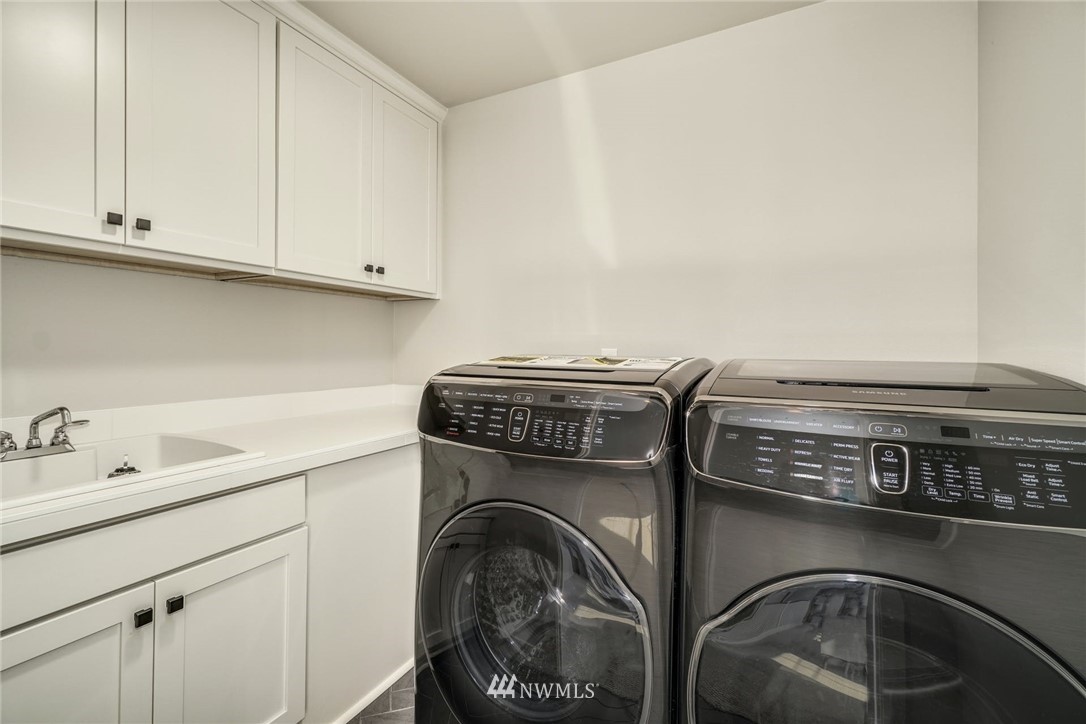 3318 238th Place Southeast Bothell, WA 98021 - Photo 16 of 36 a utility room with dryer and washer